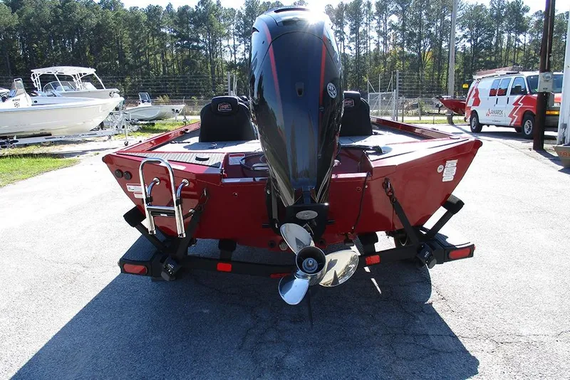 Slide: The Image of 2026 Ranger RT188P Fishing boat, rear view with motor, parked outdoors. - 8