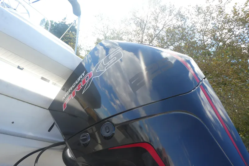 Slide: The Image of 1989 Boston Whaler 220 Outrage with Mercury Pro XS engine, outdoors. - 4