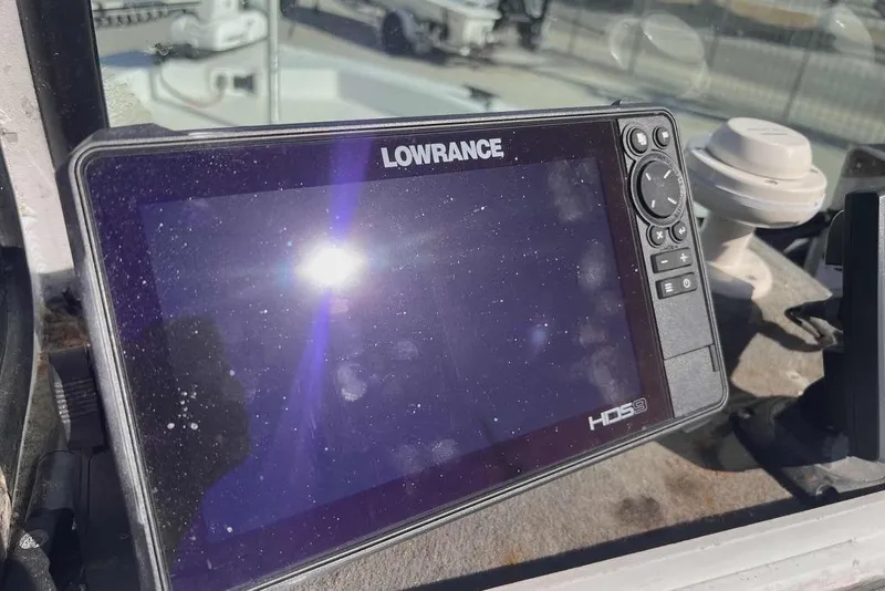 Slide: The Image of Lowrance radar on a 1997 Gravois 20CC boat, clear sky background. - 11