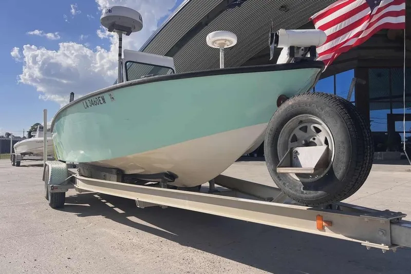 Slide: The Image of 1997 Gravois 20CC boat with Yamaha outboard motor on a trailer. - 3
