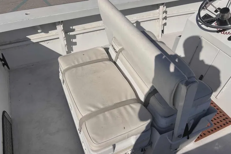 Slide: The Image of 1997 Gravois 20CC boat dashboard with steering wheel, navigation screens, and control panel. - 7