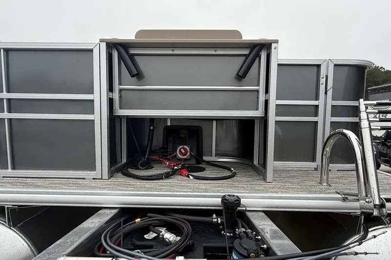 Slide: The Image of 2026 Sylvan Mirage 822 PARTY FISH pontoon boat with open storage compartment and visible wiring. - 12