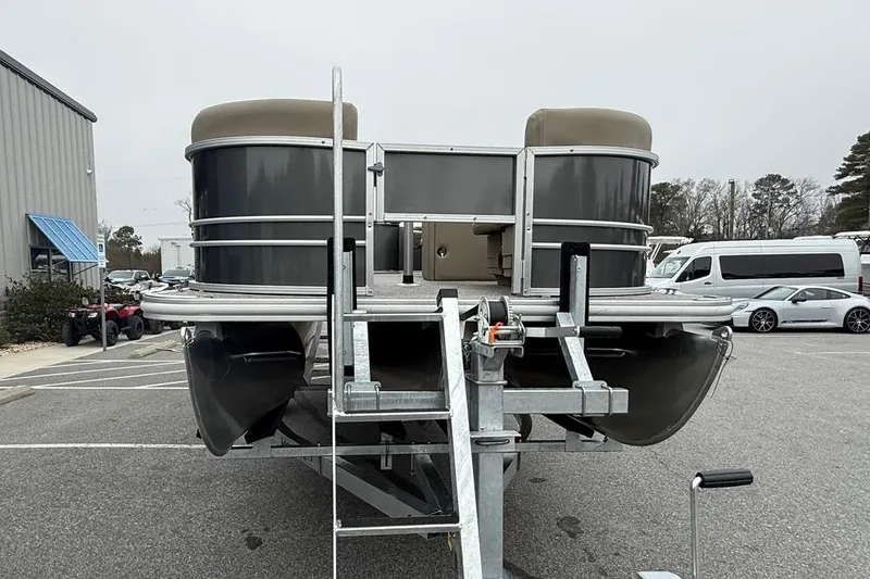 Slide: The Image of 2026 Sylvan Mirage 822 PARTY FISH pontoon boat on trailer in parking lot. - 7