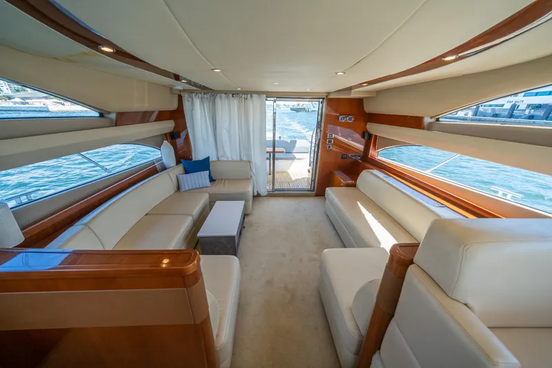 Slide: The Image of Luxurious interior of 2008 Princess 58 Flybridge yacht with elegant seating and panoramic windows. - 15