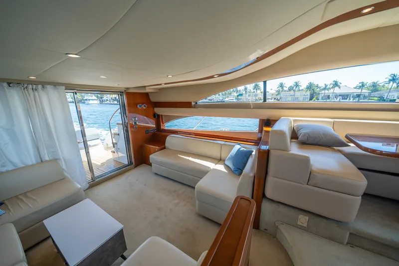 Slide: The Image of Luxurious interior of 2008 Princess 58 Flybridge yacht with elegant seating and scenic views. - 16