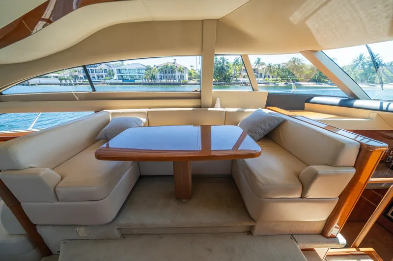 Slide: The Image of Luxurious interior of 2008 Princess 58 Flybridge yacht with elegant seating and table. - 19