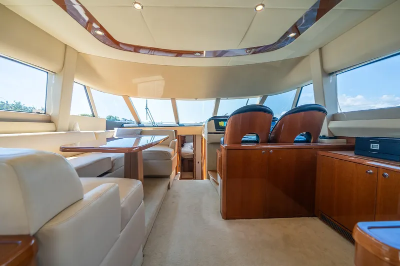 Slide: The Image of Luxurious interior of a 2008 Princess 58 Flybridge yacht with elegant seating and wood finishes. - 20
