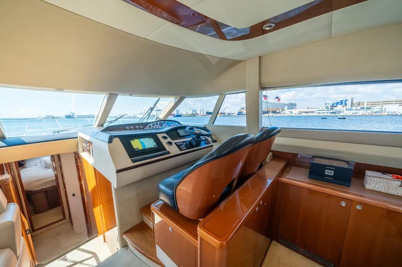 Slide: The Image of Luxurious 2008 Princess 58 Flybridge yacht interior with modern helm and panoramic views. - 21
