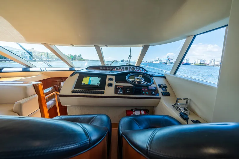 Slide: The Image of Interior view of 2008 Princess 58 Flybridge yacht cockpit with navigation equipment. - 23