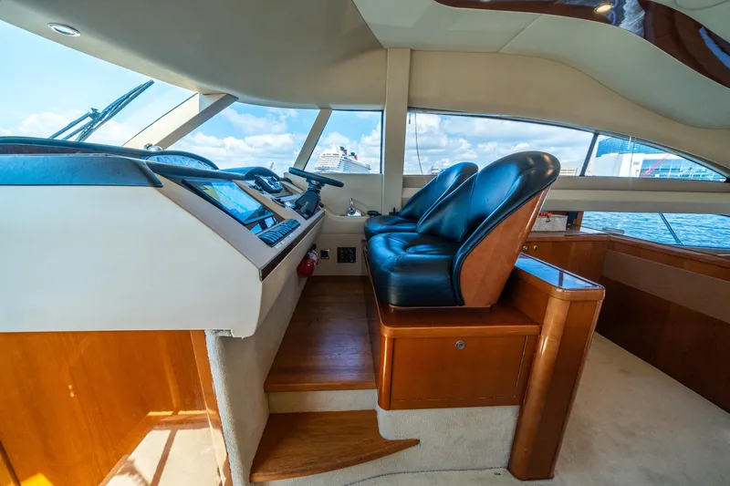 Slide: The Image of Interior of 2008 Princess 58 Flybridge yacht with leather seats and control panel. - 24