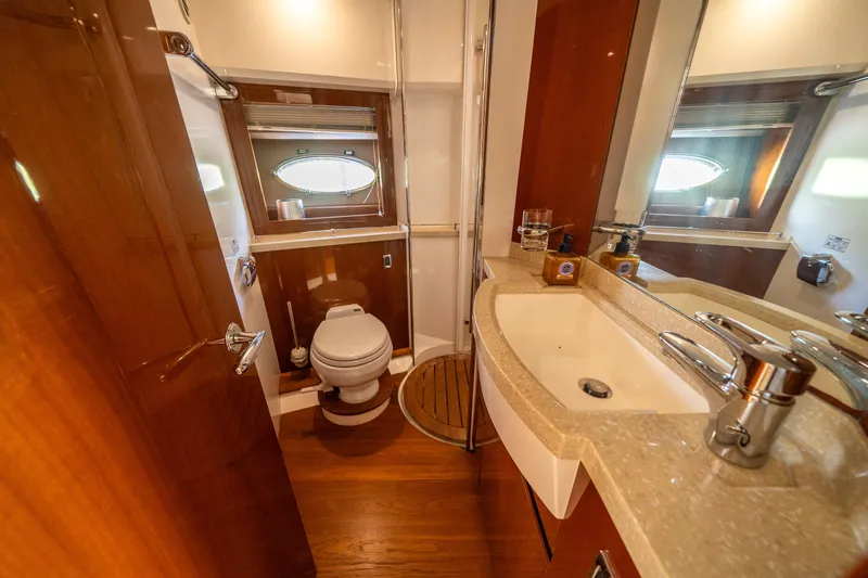 Slide: The Image of Luxurious bathroom in 2008 Princess 58 Flybridge yacht with modern fixtures and wooden accents. - 31