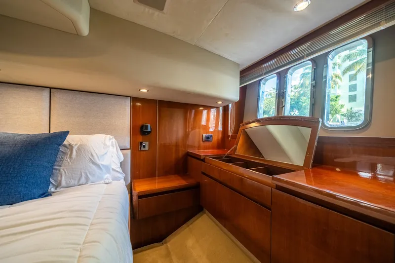 Slide: The Image of Luxurious cabin interior of 2008 Princess 58 Flybridge yacht with wood finish and windows. - 37