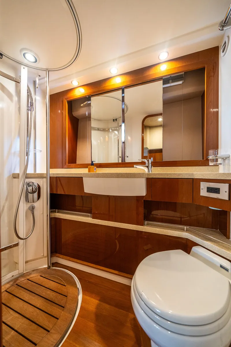 Slide: The Image of Luxurious bathroom in 2008 Princess 58 Flybridge yacht with modern fixtures and wooden accents. - 39