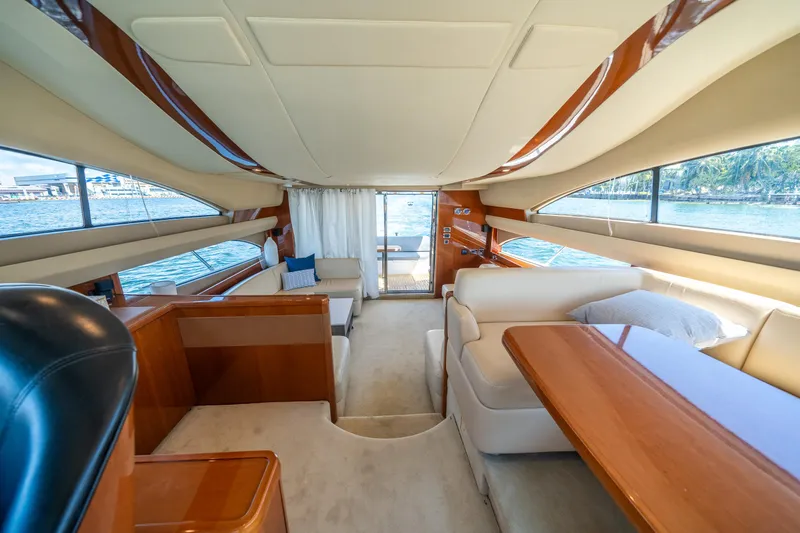 Slide: The Image of Luxurious interior of a 2008 Princess 58 Flybridge yacht with elegant seating and wood finishes. - 41