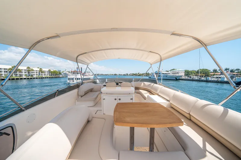 Slide: The Image of Luxurious 2008 Princess 58 Flybridge yacht with spacious seating and scenic water views. - 49