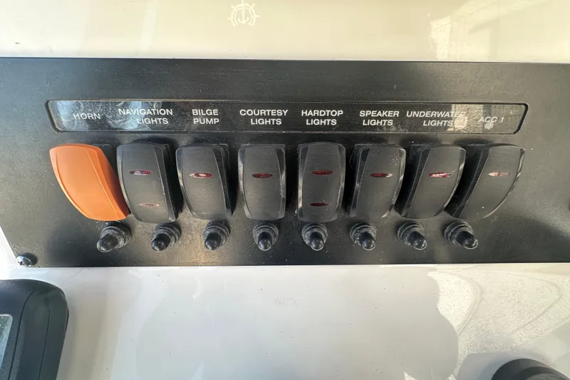 Slide: The Image of Control panel of a 2018 Blackfin 212 CC boat with labeled switches. - 32