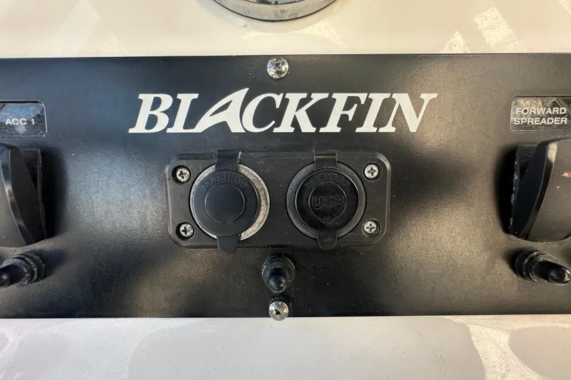 Slide: The Image of Control panel of a 2018 Blackfin 212 CC boat with USB and switches. - 35