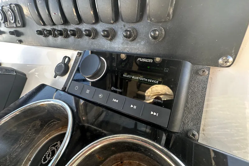 Slide: The Image of Control panel of a 2018 Blackfin 212 CC boat with Fusion audio system. - 41