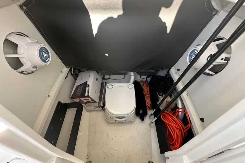 Slide: The Image of Interior of 2018 Blackfin 212 CC boat with storage, speakers, and equipment. - 59