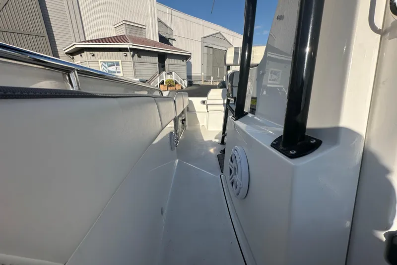 Slide: The Image of 2018 Blackfin 212 CC boat interior with white seating and modern design. - 61