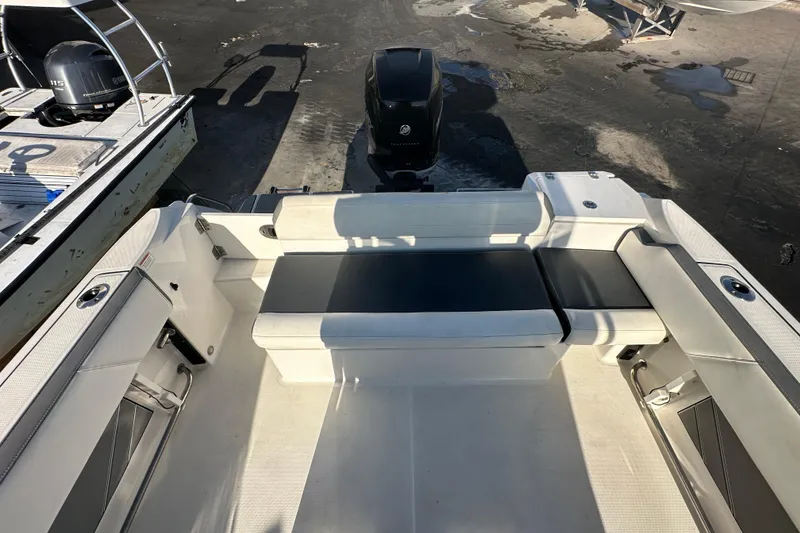 Slide: The Image of 2018 Blackfin 212 CC boat interior with seating and outboard motor. - 71
