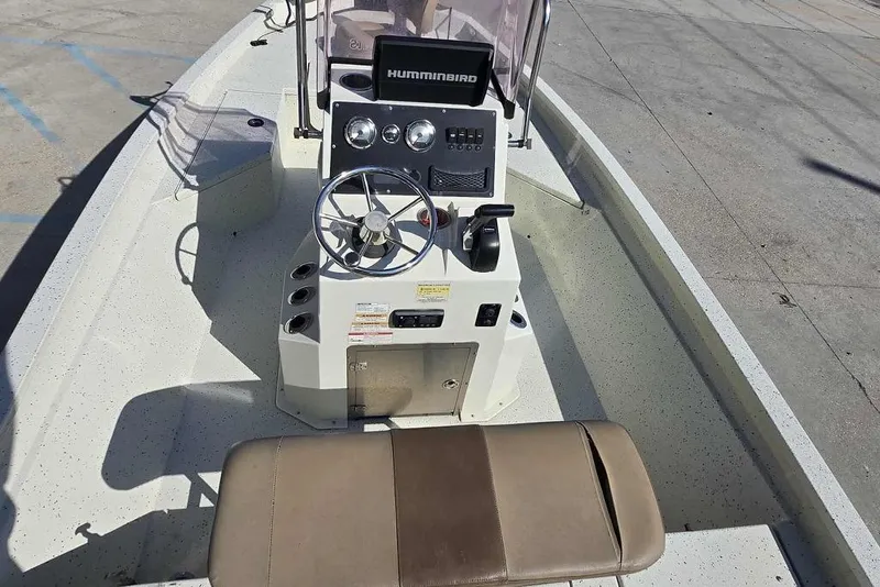 Slide: The Image of 2019 Xpress H20B Bay boat interior with steering console and seating. - 11