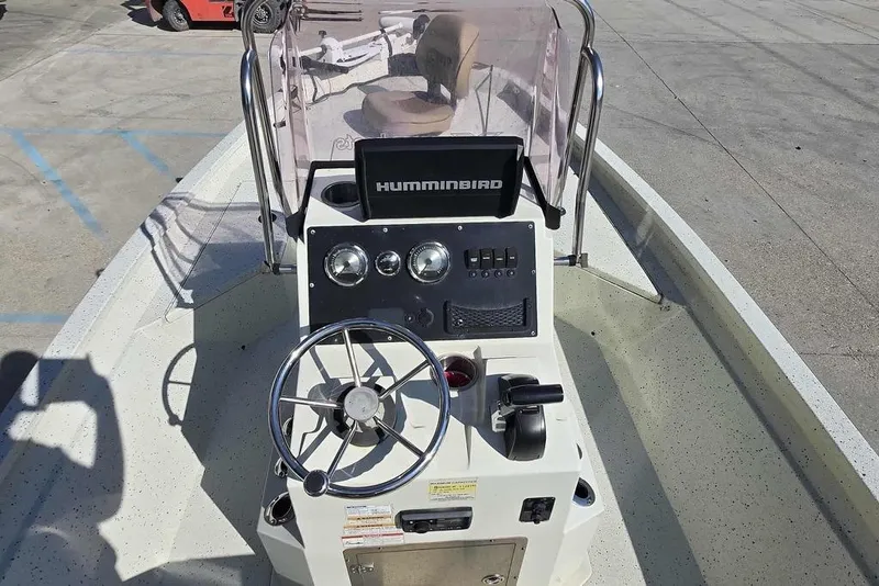 Slide: The Image of 2019 Xpress H20B Bay boat console with steering wheel and Humminbird electronics. - 12