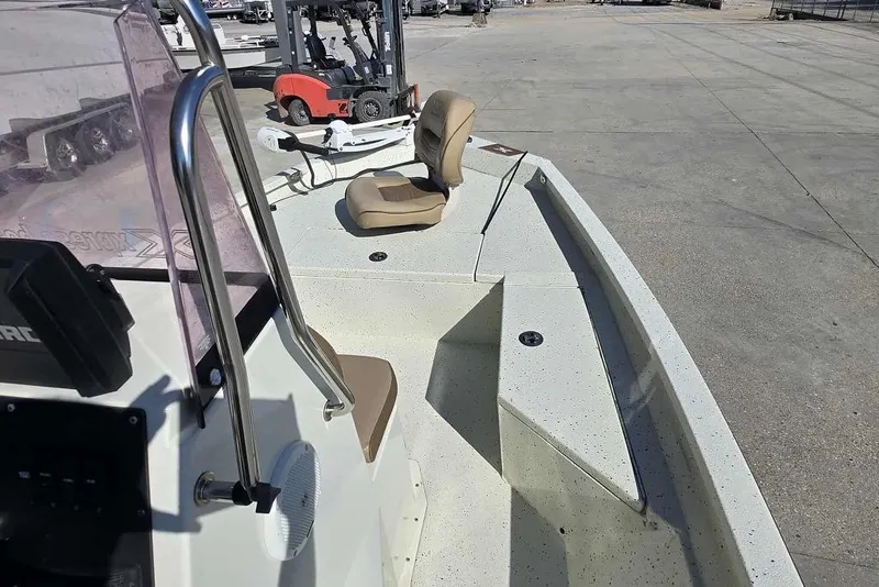 Slide: The Image of 2019 Xpress H20B Bay boat interior with seating and control panel. - 14