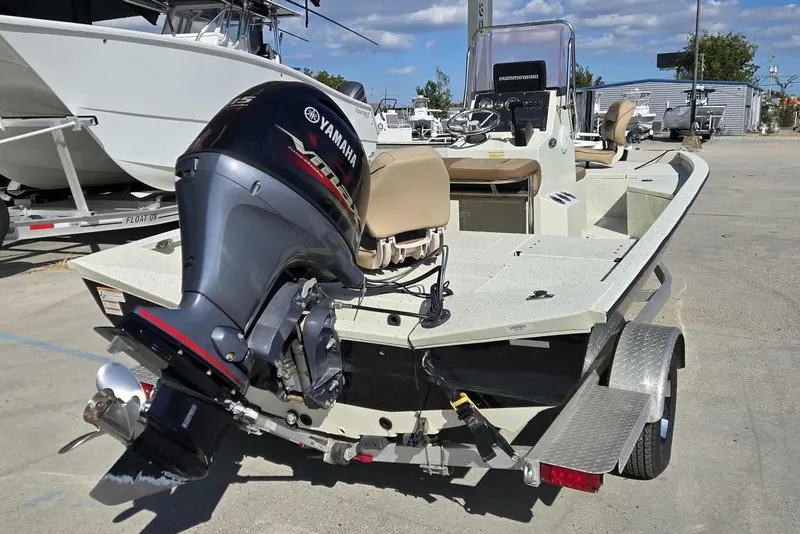 Slide: The Image of 2019 Xpress H20B Bay boat with Yamaha outboard motor on trailer. - 3