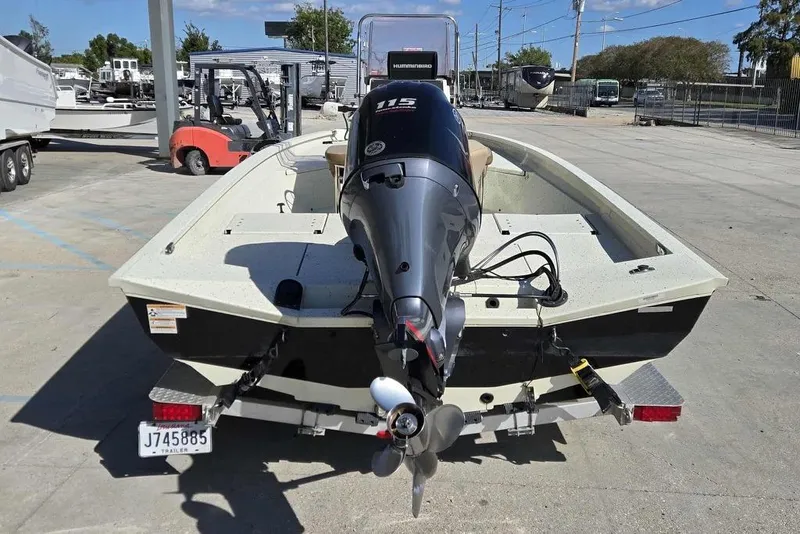 Slide: The Image of 2019 Xpress H20B Bay boat with 115 HP outboard motor on trailer. - 4