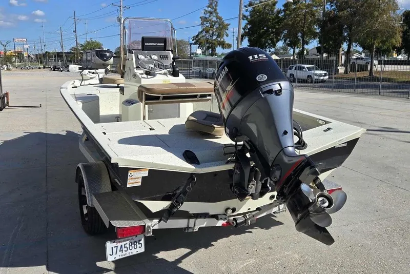 Slide: The Image of 2019 Xpress H20B Bay boat with Yamaha outboard motor on trailer. - 5