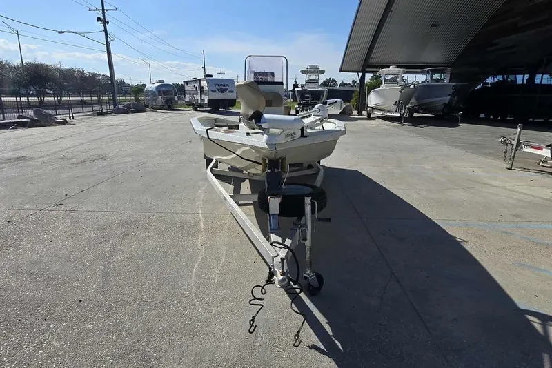 Slide: The Image of 2019 Xpress H20B Bay boat on trailer in outdoor storage area. - 8