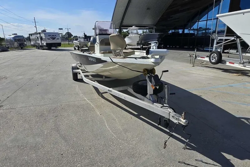 Slide: The Image of 2019 Xpress H20B Bay boat on trailer in outdoor dealership lot. - 9