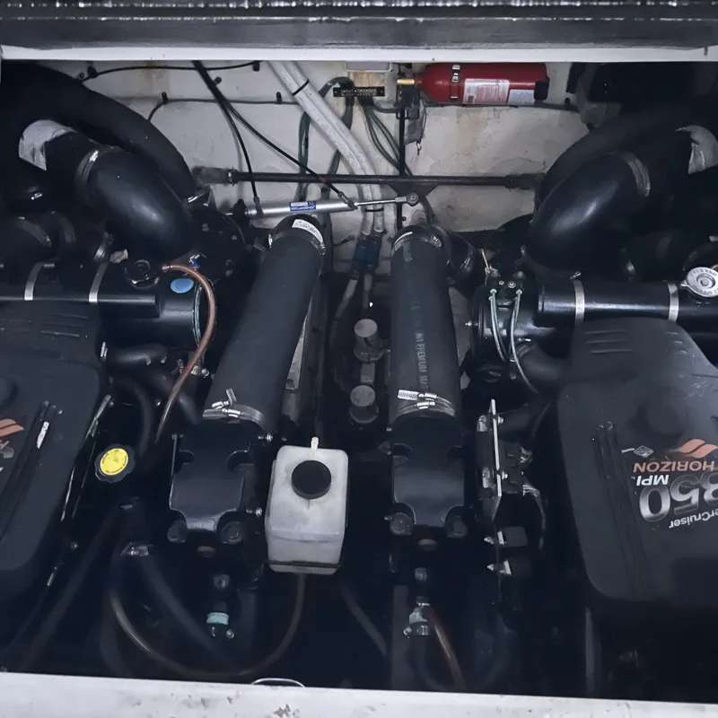 Slide: The Image of Engine compartment of a 2005 Sea Ray 290 Amberjack boat, featuring dual MPI Horizon engines. - 13