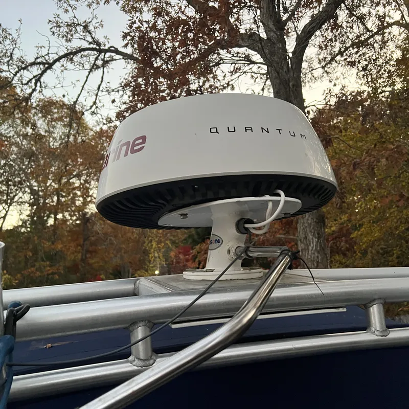 Slide: The Image of Radar system on 2005 Sea Ray 290 Amberjack boat, surrounded by autumn trees. - 14