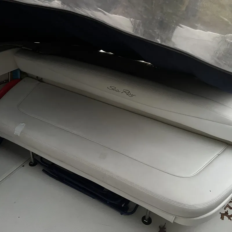 Slide: The Image of 2005 Sea Ray 290 Amberjack boat interior with cushioned seating. - 5