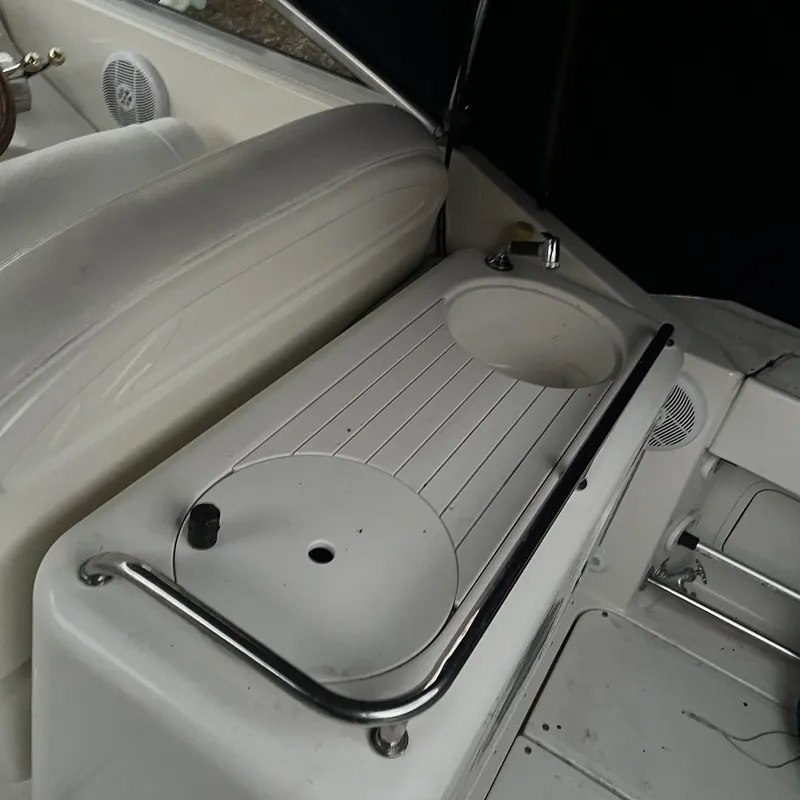 Slide: The Image of 2005 Sea Ray 290 Amberjack boat interior with sink and seating area. - 6