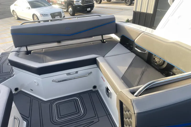 Slide: The Image of 2023 Cobalt R6 Surf boat interior with gray seating and modern design. - 16