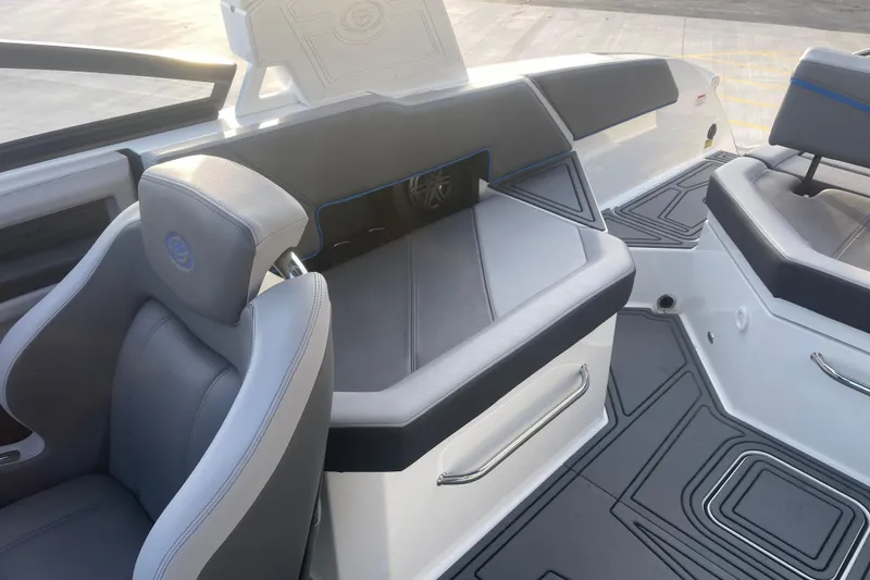 Slide: The Image of 2023 Cobalt R6 Surf boat interior with sleek seating and modern design. - 17