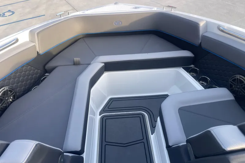 Slide: The Image of 2023 Cobalt R6 Surf boat interior with sleek gray seating and modern design. - 22