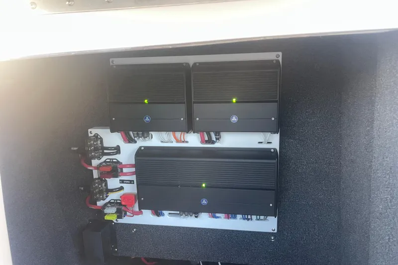 Slide: The Image of 2023 Cobalt R6 Surf boat electrical system with amplifiers and wiring. - 26