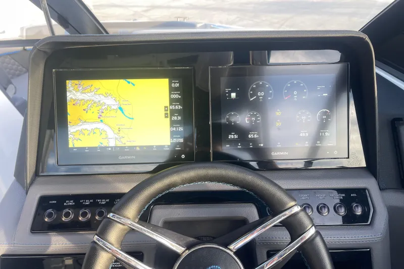Slide: The Image of Dashboard of 2023 Cobalt R6 Surf boat with dual Garmin displays. - 32
