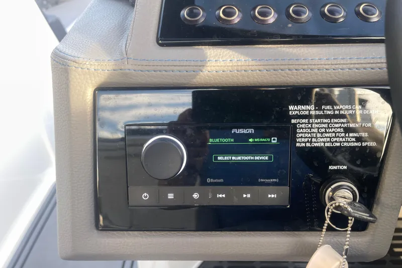 Slide: The Image of 2023 Cobalt R6 Surf dashboard with Fusion Bluetooth audio system and ignition keys. - 35