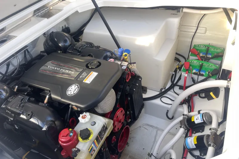 Slide: The Image of 2023 Cobalt R6 Surf engine compartment with Volvo Penta motor and battery setup. - 37