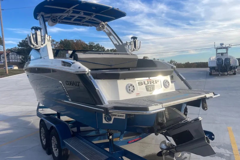 Slide: The Image of 2023 Cobalt R6 Surf boat on trailer, showcasing sleek design and modern features. - 7