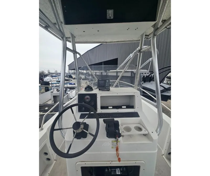 Slide: The Image of 1997 Stratos 1870 CC boat console with steering wheel and navigation equipment. - 4