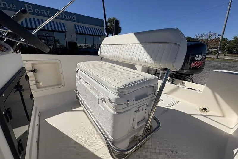 Slide: The Image of 2002 Key West 1900 Center Console boat interior with seating and Yamaha outboard motor. - 11