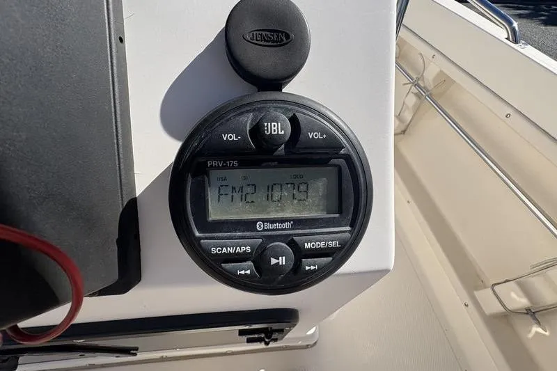 Slide: The Image of JBL radio on 2002 Key West 1900 Center Console, displaying FM 107.9 frequency. - 14