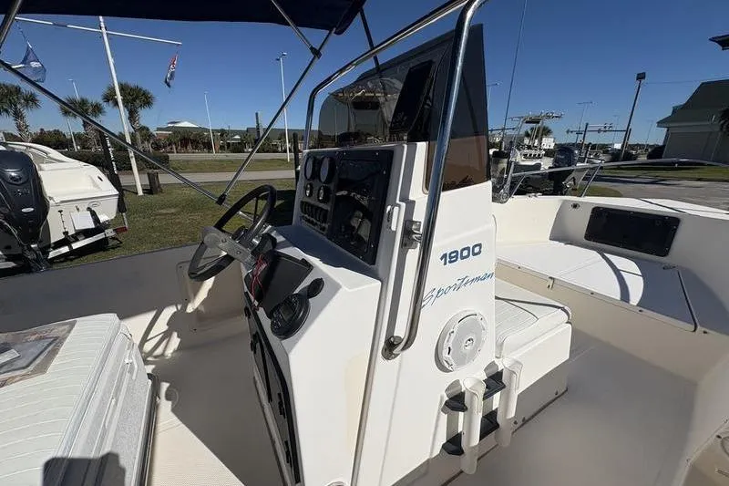 Slide: The Image of 2002 Key West 1900 Center Console boat interior with steering wheel and controls. - 16