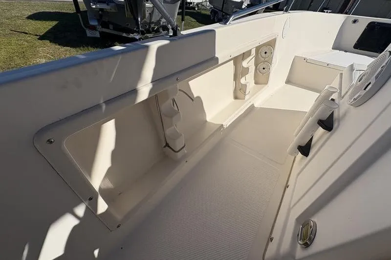 Slide: The Image of 2002 Key West 1900 Center Console boat interior with storage compartments. - 18